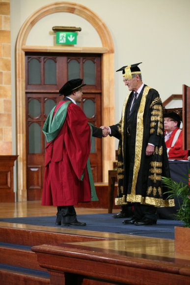 PhD_graduand_shaking_hands_with_Sir_Dominic_Cadbury,_the_Chancellor_of_the_University_of_Birmingham_-_20120705
